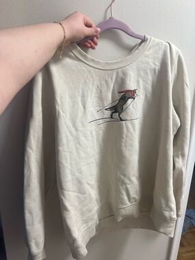 Cream Pullover Sweatshirt with Skiing Fox Graphic